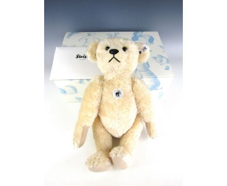 A Steiff 1909 Teddy bear in blonde mohair with original carton and tags