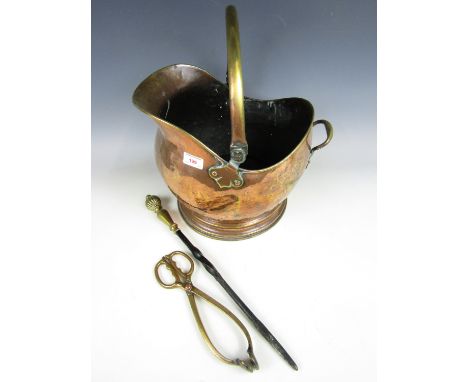 A brass coal helmet together with a poker etc.