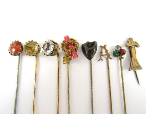 19th Century and later gilt and white metal stick pins, together with one other set with a carnelian cabochon, tests as silve