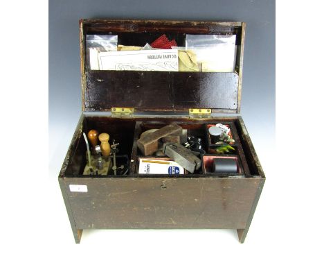 A vintage wooden case containing a large quantity of leather working and other tools etc. 