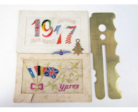 Sundry militaria including two silk postcards, a button stick, an RAF sweetheart brooch and a miniature 1914 star