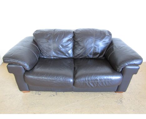 A contemporary three seater brown leather sofa, together with matching two seater leather sofa