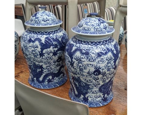 BALUSTER VASES WITH COVERS, a pair, 45cm H, Chinese Export style, blue and white ceramic, dragon decoration. (2) 