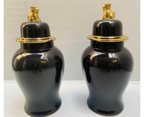 TEMPLE JARS, a pair, black glazed ceramic with gilt accents, 67cm x 32cm. 