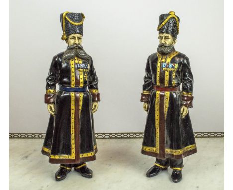 COSSACKS, a pair, 40cm x 13cm, in the manner of Fabergé, Russian cold cast, hand painted inscribed to feet '1912' . (2) 