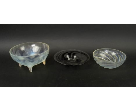 R. LALIQUE GLASS BOWLS, France, leaf decoration to outside of body, stump feet, signed, together with a fish decorated bowl, 