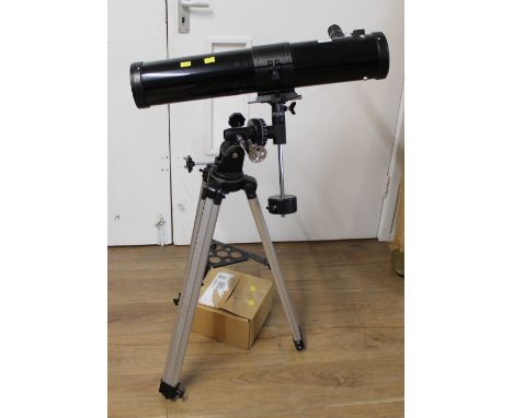 Optus telescope on extendable tripod stand, the instruction manual entitled "Reflector Telescope with EQ7 Mount"