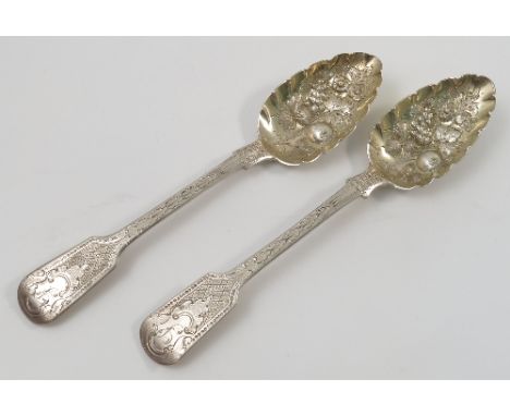A pair of Georgian silver berry serving spoons, with embossed and engraved decoration, London 1825, weight 4oz, together with