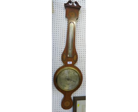 A 19th century satinwood wheel barometer, with break arch pediment over a thermometer with silvered scale, the silvered dial 