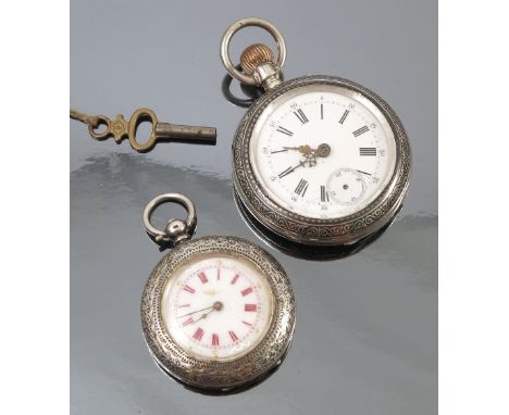 A Swiss open faced pocket watch, with niello decoration, the white enamel dial with black Roman numerals, gilt open work hand