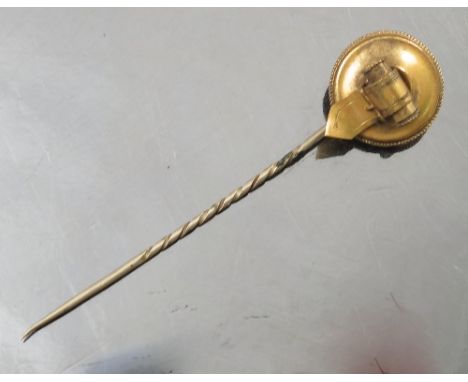 A 19th century gilt metal stick pin, with circular roundel decorated with buckle,FITTED WITH A STANHOPE OF THE LORDS PRAYER  