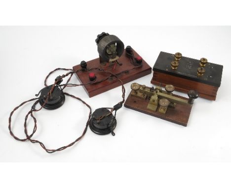 A brass morse code machine, on mahogany base, together with a Gambrell Bros & Co Ltd speaker and headphones set 
