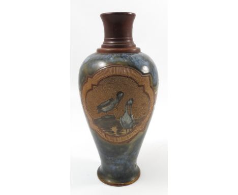 A Doulton Lambeth Florence Barlow stoneware vase, of baluster form, decorated with shaped panels each containing two pelicans