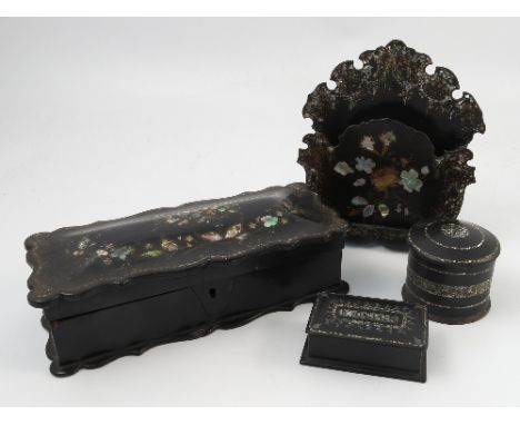 A 19th century black papier mache letter rack, with mother of pearl and gilt decoration, af, together with a rectangular box,