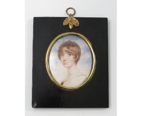 A 19th century oval portrait miniature, painted on ivory, of a woman, inscribed verso Lady William Bentinck, maximum diameter