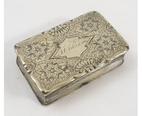 A 19th century gilt metal snuff box, of shaped rectangular form, engraved with flowers and leaves, the cartouche engraved T O