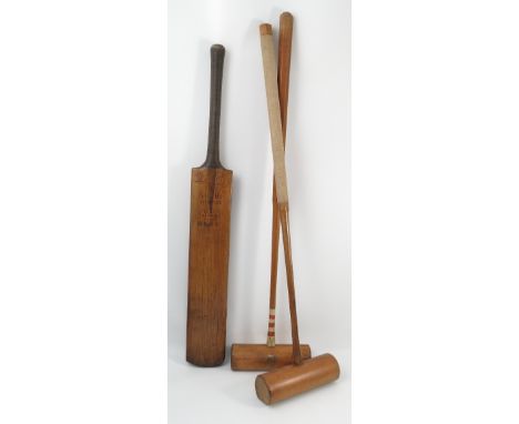 Two Army and Navy croquet mallets, together with a Sharp Liverpool cricket bat