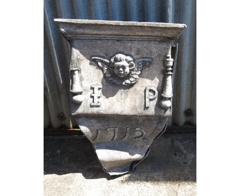 A lead rainwater hopper, bearing date 1712, a cherub and initials 'IP'