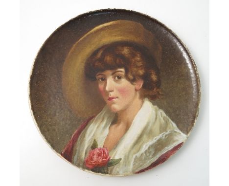 A 19th century Copeland wall plate, decorated with a portrait of a woman wearing a hat with a red rose, number 14, diameter 1