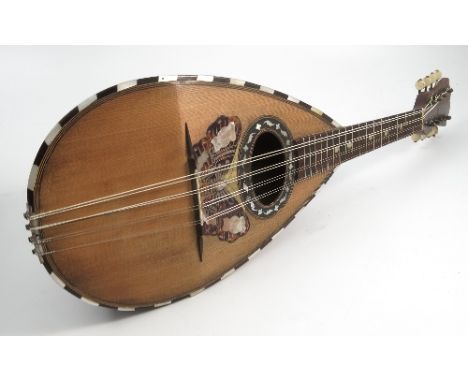 A Stridente Napoli mandolin, with mother of pearl and tortoiseshell decoration to include a butterfly, bearing paper label, c