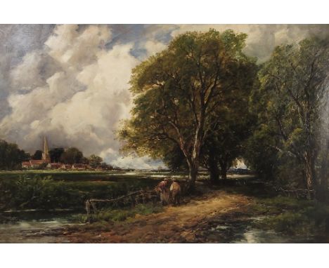 E M Wimperis, oil on canvas, figures by a stream in woodland with church and buildings beyond, 24ins x 36ins