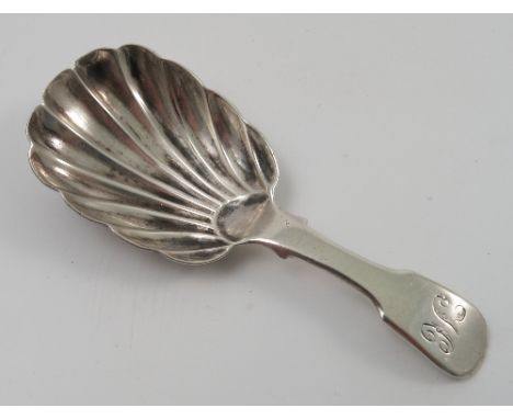 A Georgian silver fiddle pattern caddy spoon, with fluted bowl, London 1825