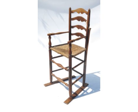 A child's North Country ladder back high chair, with wicker seat