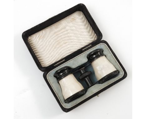 A pair of cased metal opera glasses, with mother of pearl effect decoration, stamped 'Foreign'
