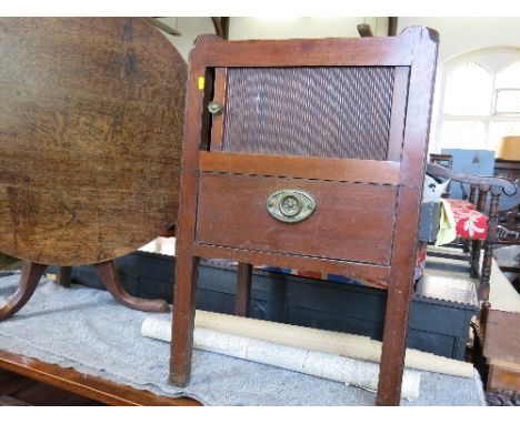 A 19th century tray top commode, having a tambour sliding door, over single drawer, raised on square legs