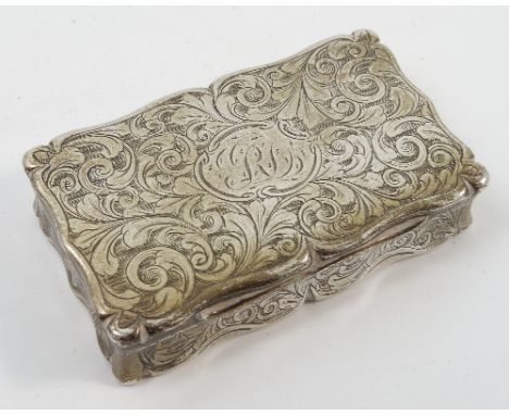 A Victorian silver snuff box, of shaped rectangular form with engraved scroll decoration, engraved to the gilt was interior w