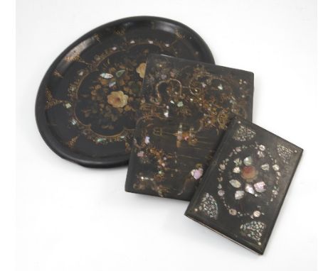 A 19th century oval black papier mache tray, with mother of pearl and gilt decoration, af, maximum diameter 17ins, together w