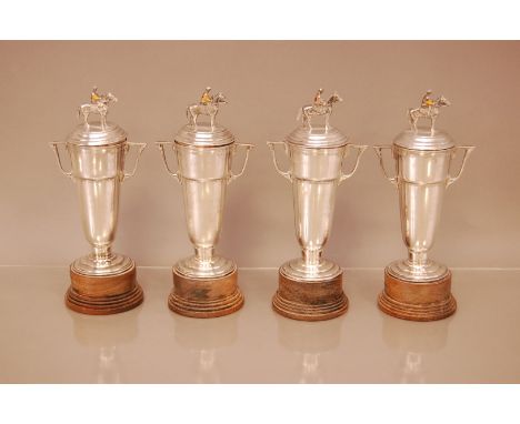 A collection of four Indian silver horseracing trophies and covers, 19cm, each won by Joe Mercer in the late 1970s, including