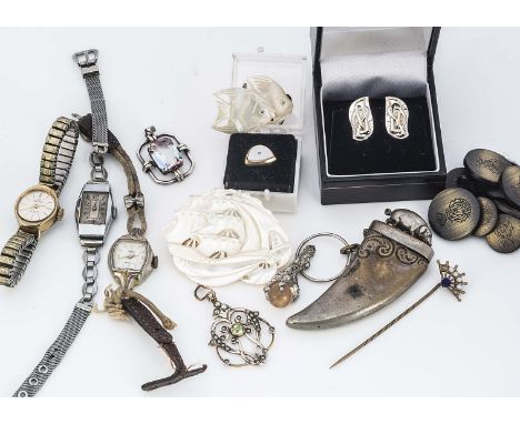A mother of pearl carved brooch, in the form of a galleon at full sail, together with a pair of fish carved earrings, a silve