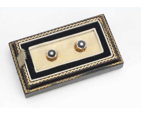 A pair of Art Deco diamond and onyx yellow and white metal octagonal shaped dress studs, the screw off yellow metal backs mar