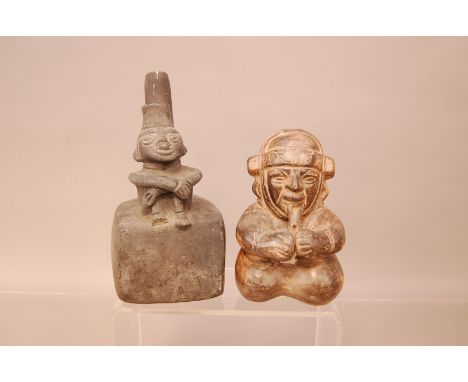 Two pre-Columbian pottery vessels, one in a material similar to basalt modelled with a man sat at the front, 19cm, chipped, p