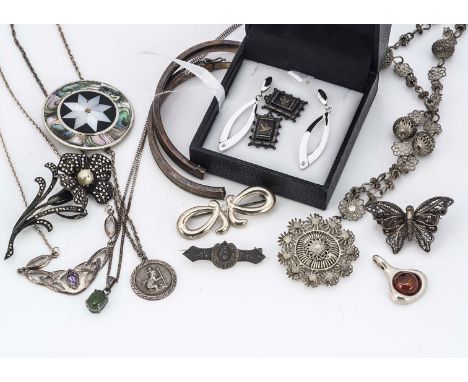 A collection silver jewels, including a floral brooch with a marcasite and simulated pearl, a filigree butterfly, a mother of