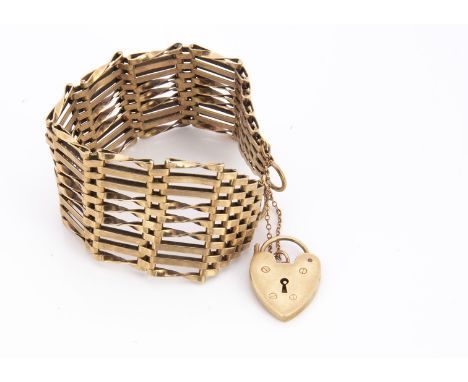 A 9ct gold nine bar gate link bracelet, with padlock heart shaped clasp, 18cm, 29.5g