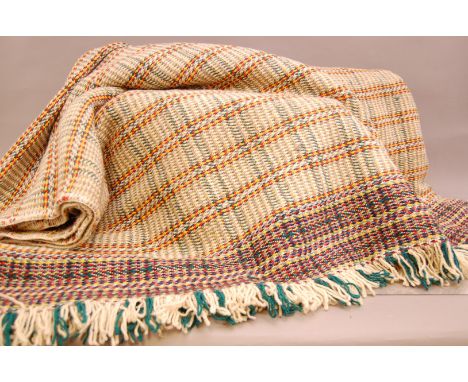 A pair of c1970s Welsh tapestry woollen blankets, one 185cm wide and 248cm, the other slightly smaller, with label for Amgued