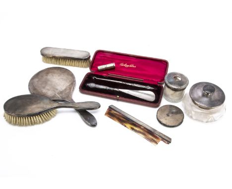 An Art Deco four piece dressing table set, together with a similar engine turned lipstick holder, compact, glass powder pot w