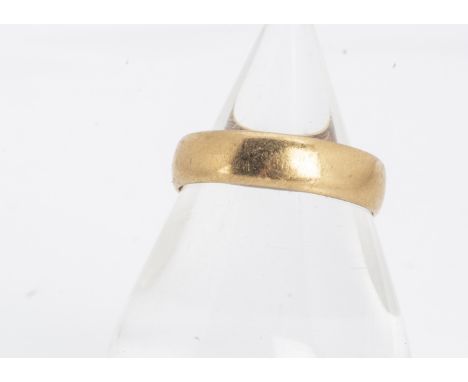 A 22ct gold wedding band, of flattened form, with slightly curved profile, 5mm thick, ring size R, 4.5g