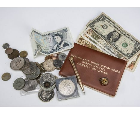 A collection of British coins, including several modern £5 and £2 coins, a Somerset £5 note, creased, and more, along with a 