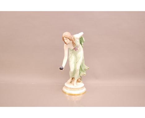 An early 20th century Meissen porcelain figure of a lady playing bowls designed by Walter Schott, 36cm, restored to right arm