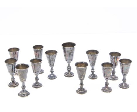 A group of 12 silver Kiddish cups, all similar in design, varying sizes and makers, AF (12)