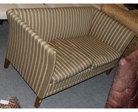 A mid-20th century two-seater sofa upholstered in striped fabric 