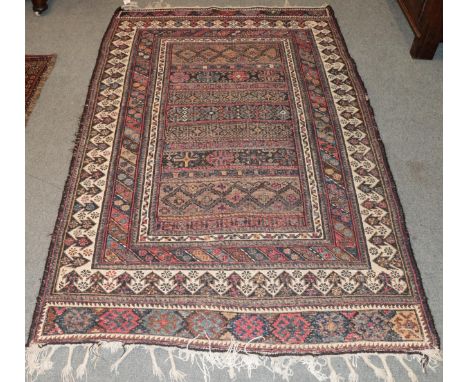 Afshar flatweave rug, the walnut brown and indigo field of bands of geometric motifs enclosed by reciprocal arrow head border