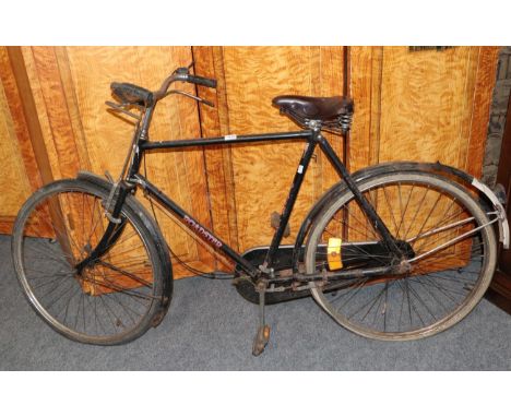 A vintage bicycle Pashley with brown leather seat