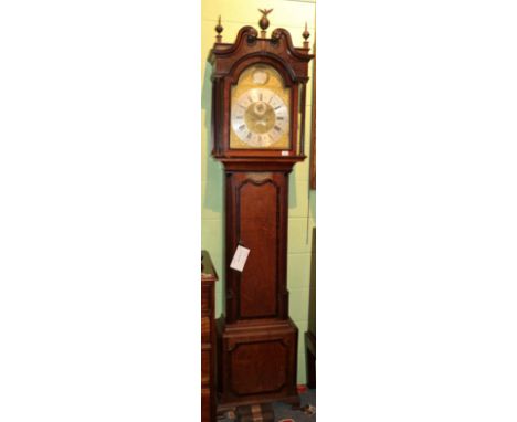 An oak eight day longcase clock, bearing a later inscription James Rishton Rochdale, trunk with a presentation plaque