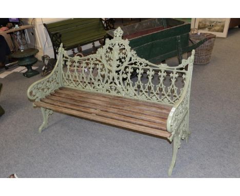 A painted cast metal garden bench, after a Coalbrookdale original, with foliate and strapwork decoration and wooden slats, 14