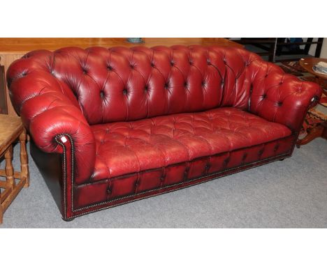 A red leather Chesterfield sofa  