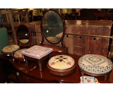 An early 19th century mahogany dressing mirror above a serpentine base with three drawers; another dressing mirror, five foot